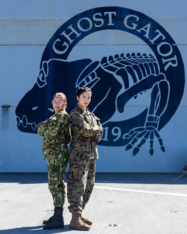 U.S. Marine Corps Lance Cpl. Charisse Briguera, right, a rifle Marine with Delta Company, 4th Light Armored Reconnaissance Battalion, 4th Marine Division, in support of Special Purpose Marine Air-Ground Task Force UNITAS LXIII poses for a photo with Marina Milagros Correa (Private Uruguayan Marine Corps) during exercise UNITAS LXIII aboard the USS Mesa Verde (LPD 19), Sept. 18, 2022. UNITAS trains forces to conduct joint maritime operations through the execution of anti-surface, anti-submarine, anti-air, amphibious, and electronic warfare operations that enhance warfighting proficiency and increase interoperability among participating navy and marine forces. (U.S. Marine Corps photo by Lance Cpl. David Intriago)