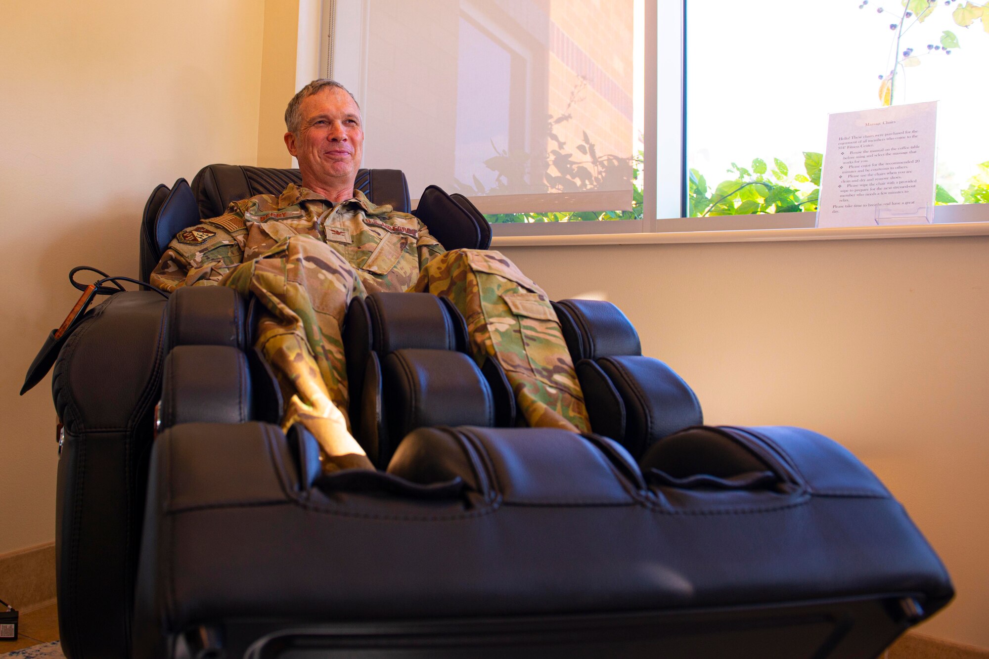 Col Gregory Berry, 934 AW vice commander, tries out one of the massage chairs during the opening of the new wellness center at the Minneapolis-St. Paul Air Reserve Station, Minnesota on Oct. 5, 2022. (U.S. Air Force photo by Chris Farley) The wellness center is for base personnel to use for de-stressing from work tension or for simply relaxing in a comfortable environment.