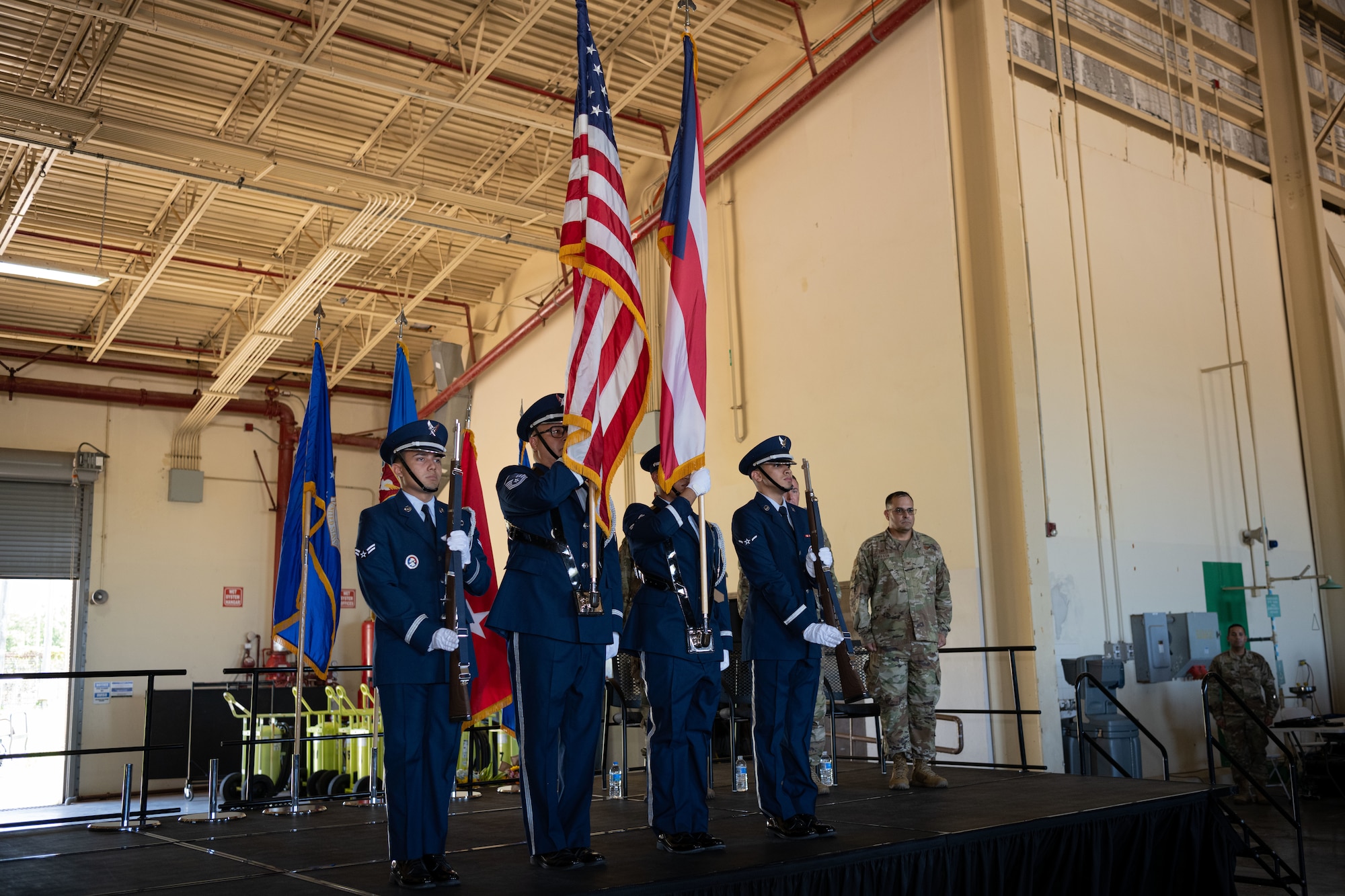 U.S. Airmen with the 156th Wing Honor Guard, present the colors during the 156th Wing change of command ceremony at Muñiz Air National Guard Base, Carolina, Puerto Rico, Oct. 15, 2022. The change of command ceremony took place during the October regularly scheduled drill. (U.S. Air National Guard photo by Staff Sgt. Eliezer Soto)