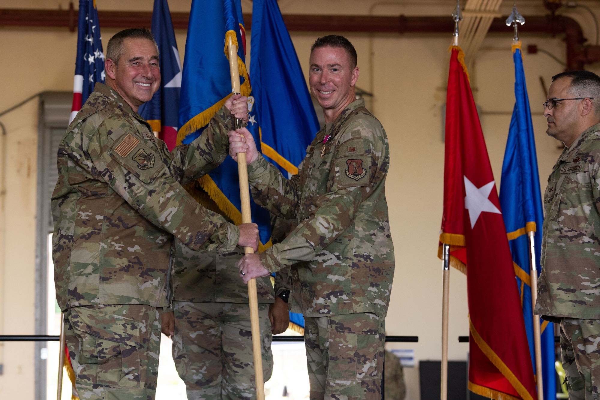 U.S. Air Force Col. Pete Boone, the outgoing 156th Wing commander, relinquishes command to U.S. Air Force Brig. Gen. Paul Loiselle, the assistant adjutant general-air, Puerto Rico Air National Guard, during the 156th Wing change of command ceremony at Muñiz Air National Guard Base, Carolina, Puerto Rico, Oct. 15, 2022. The change of command ceremony took place during the October regularly scheduled drill. (U.S. Air National Guard photo by Staff Sgt. Eliezer Soto)