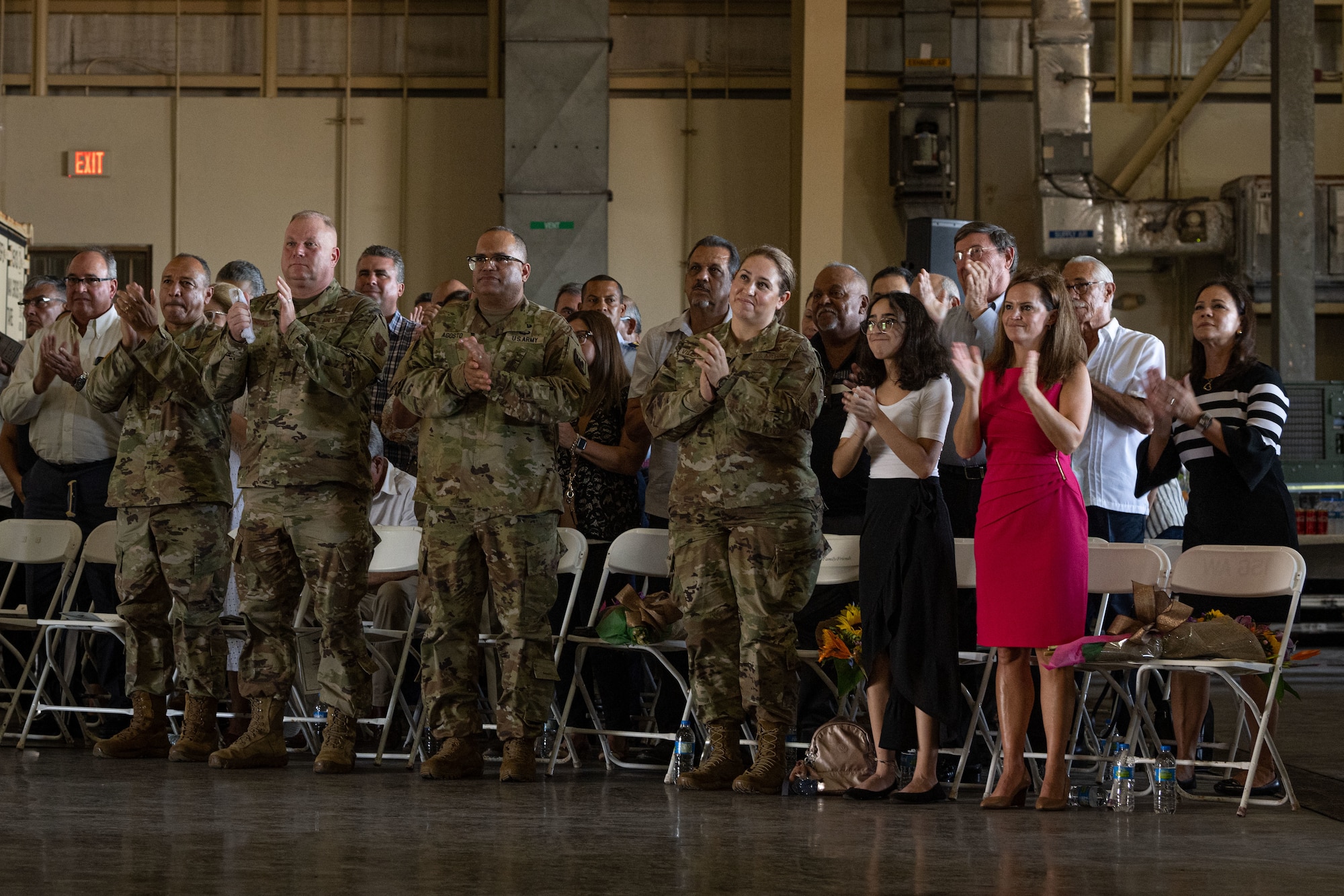 Family members and guests applaud after U.S. Air Force Col. Humberto Pabon Jr., the incoming 156th Wing commander, finishes his assumption of command speech during the 156th Wing change of command ceremony at Muñiz Air National Guard Base, Carolina, Puerto Rico, Oct. 15, 2022. The change of command ceremony took place during the October regularly scheduled drill. (U.S. Air National Guard photo by Staff Sgt. Eliezer Soto)