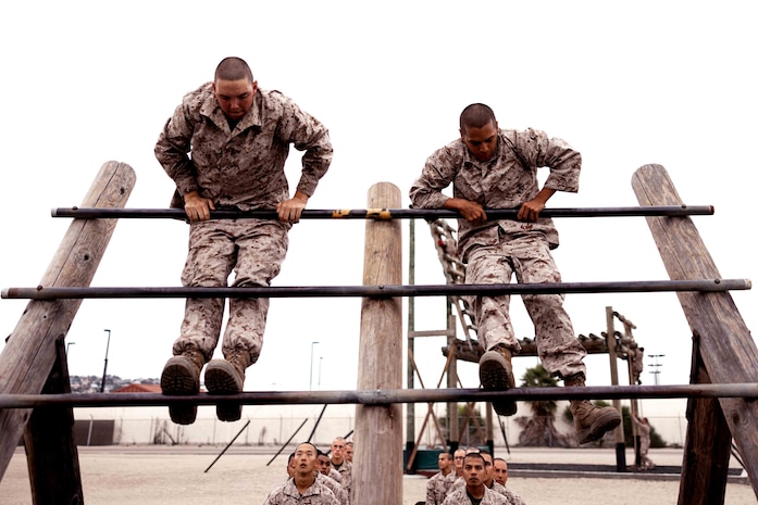 U.S. Marine Corps recruits with Kilo Company, 3rd Recruit Training Battalion, conduct the reverse climb during the confidence course at Marine Corps Recruit Depot San Diego, Oct. 11, 2022.