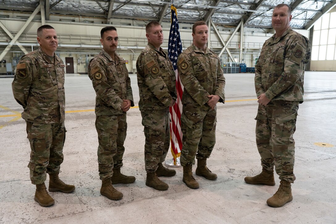 A photo of Chief Master Sgt. Jeremy Miller, Tech Sgt. Kegan Stanko,  Tech Sgt. Sean Peck, Staff Sgt. Damian McKinse and Chief Master Sgt. Nathan Breitenfield.