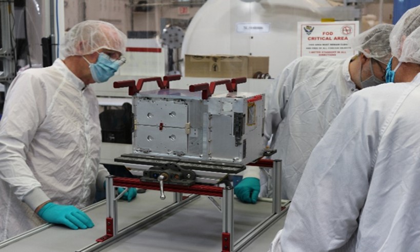 Air Force Research Laboratory technicians work on the Ascent spacecraft in the AFRL Space Vehicles Directorate’s small satellite laboratory at Kirtland Air Force Base, New Mexico in 2021. Ascent, which analyzed the survivability of electronics in geosynchronous Earth orbit, recently completed all its mission objectives and is currently performing extended operations. (U.S. Air Force photo / Capt. Sunderlin Jackson)