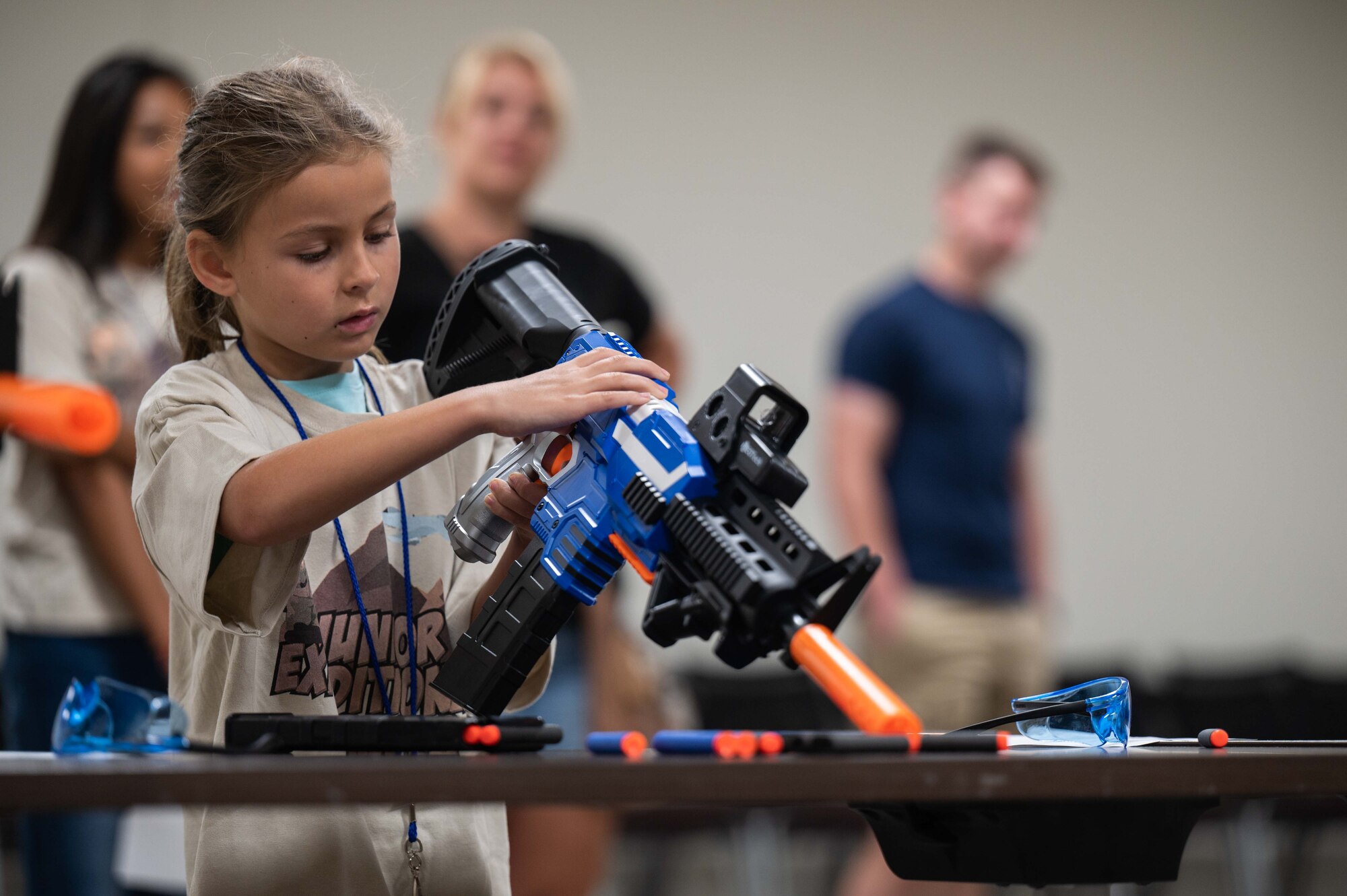 A photo of kids shooting nerf guns