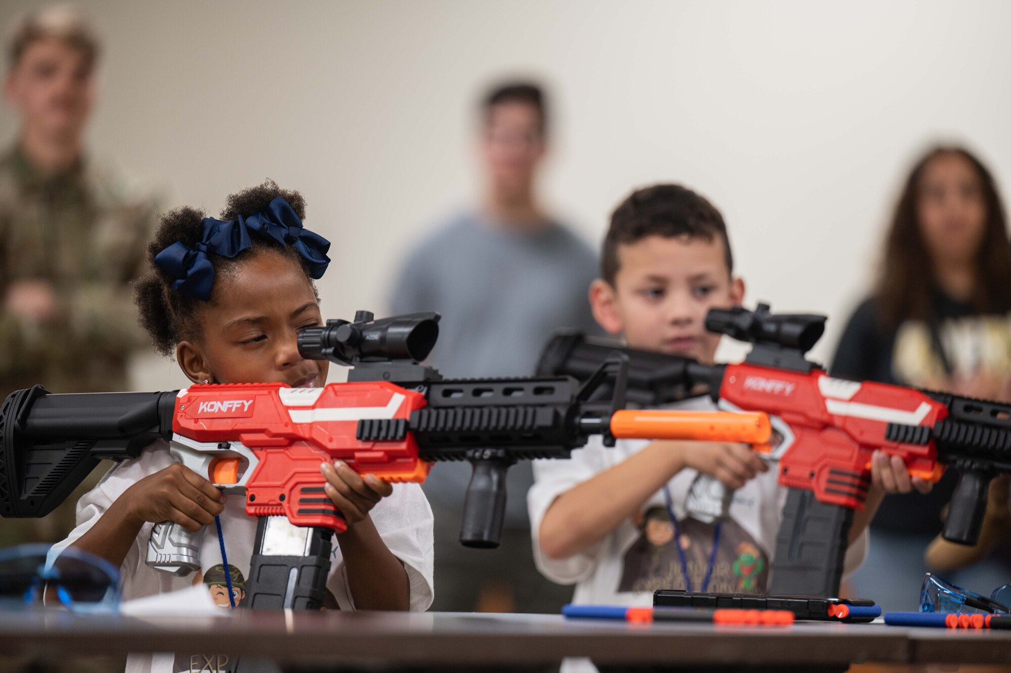 A photo of kids shooting nerf guns