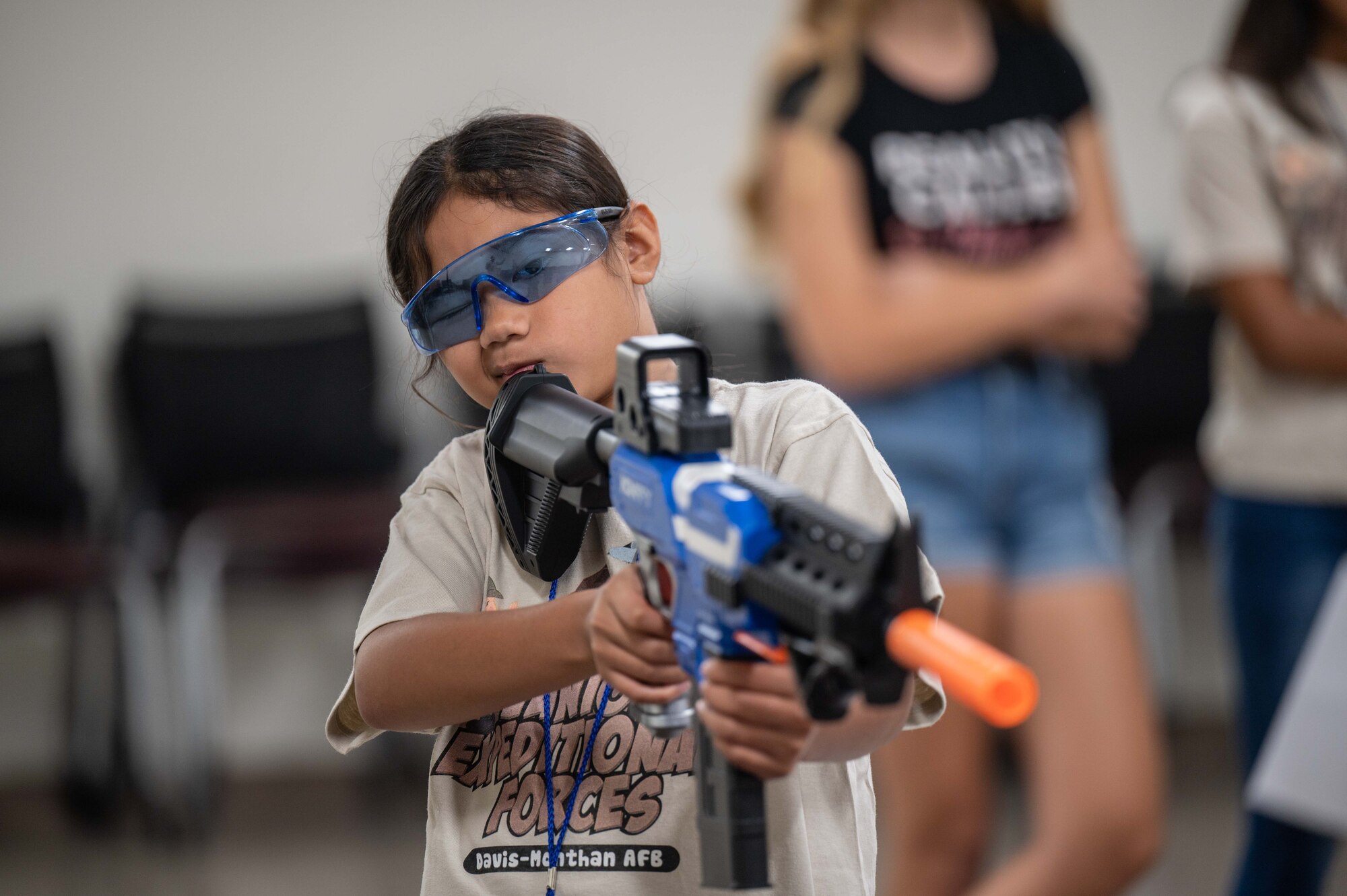 A photo of kids shooting nerf guns