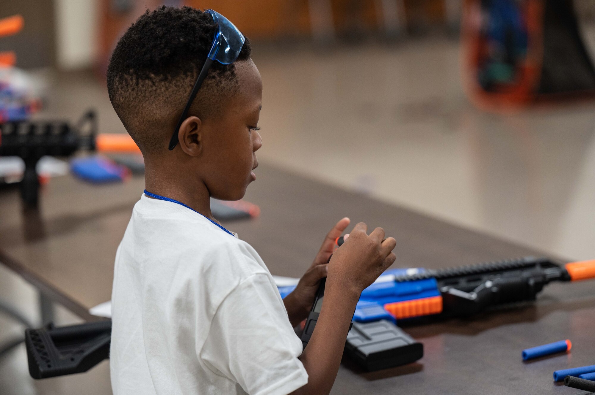 A photo of kids shooting nerf guns