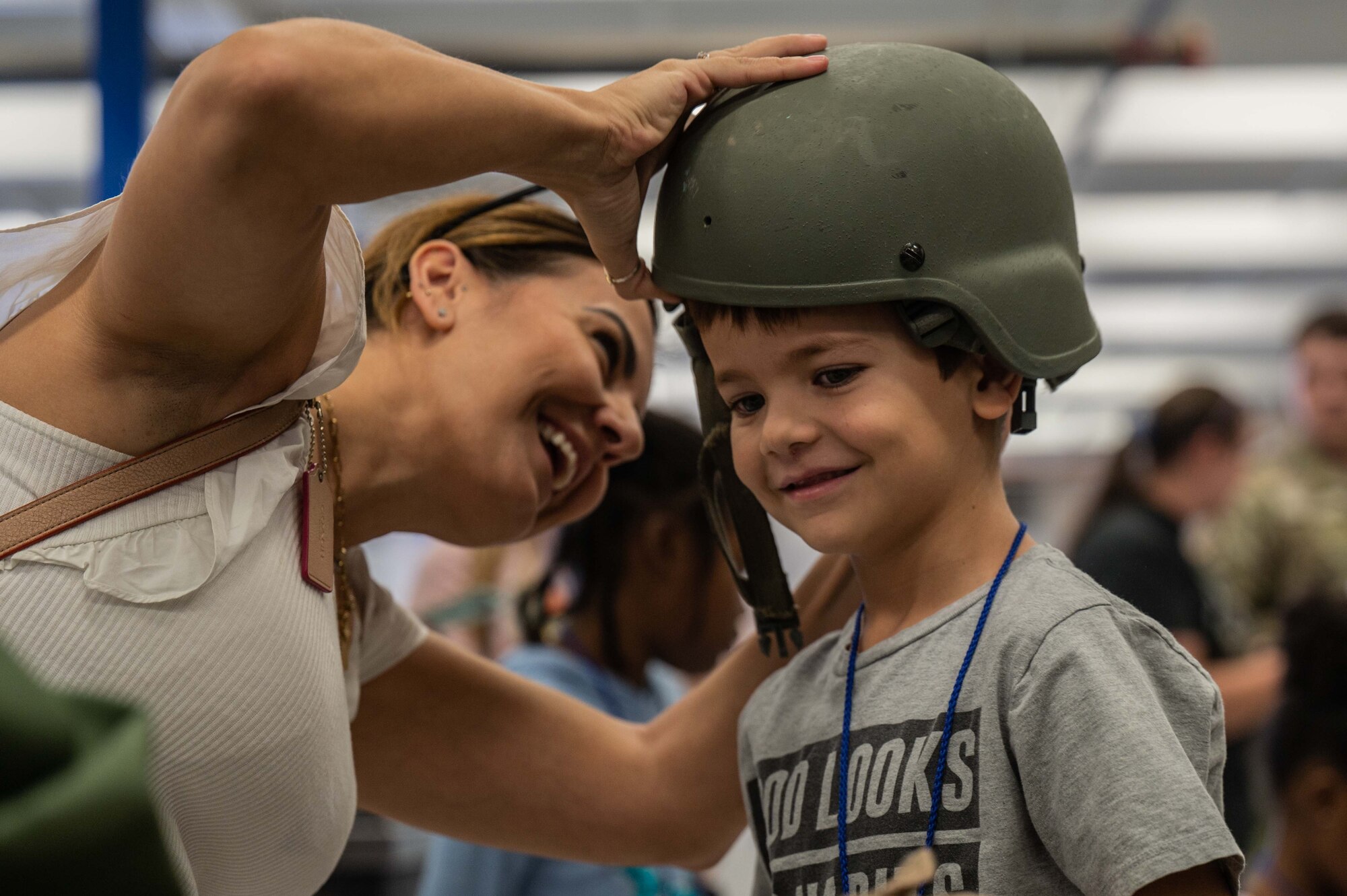 A photo of kids trying on military equipment