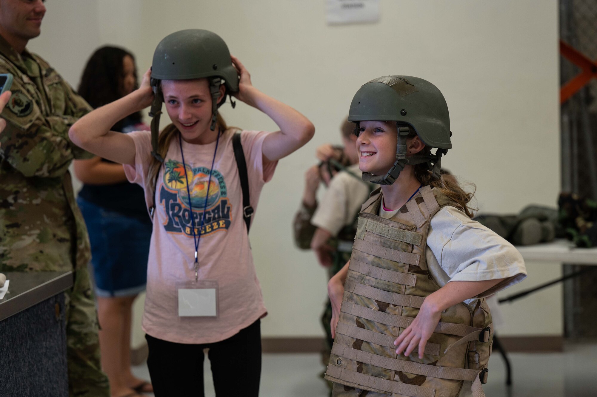 A photo of kids trying on military equipment