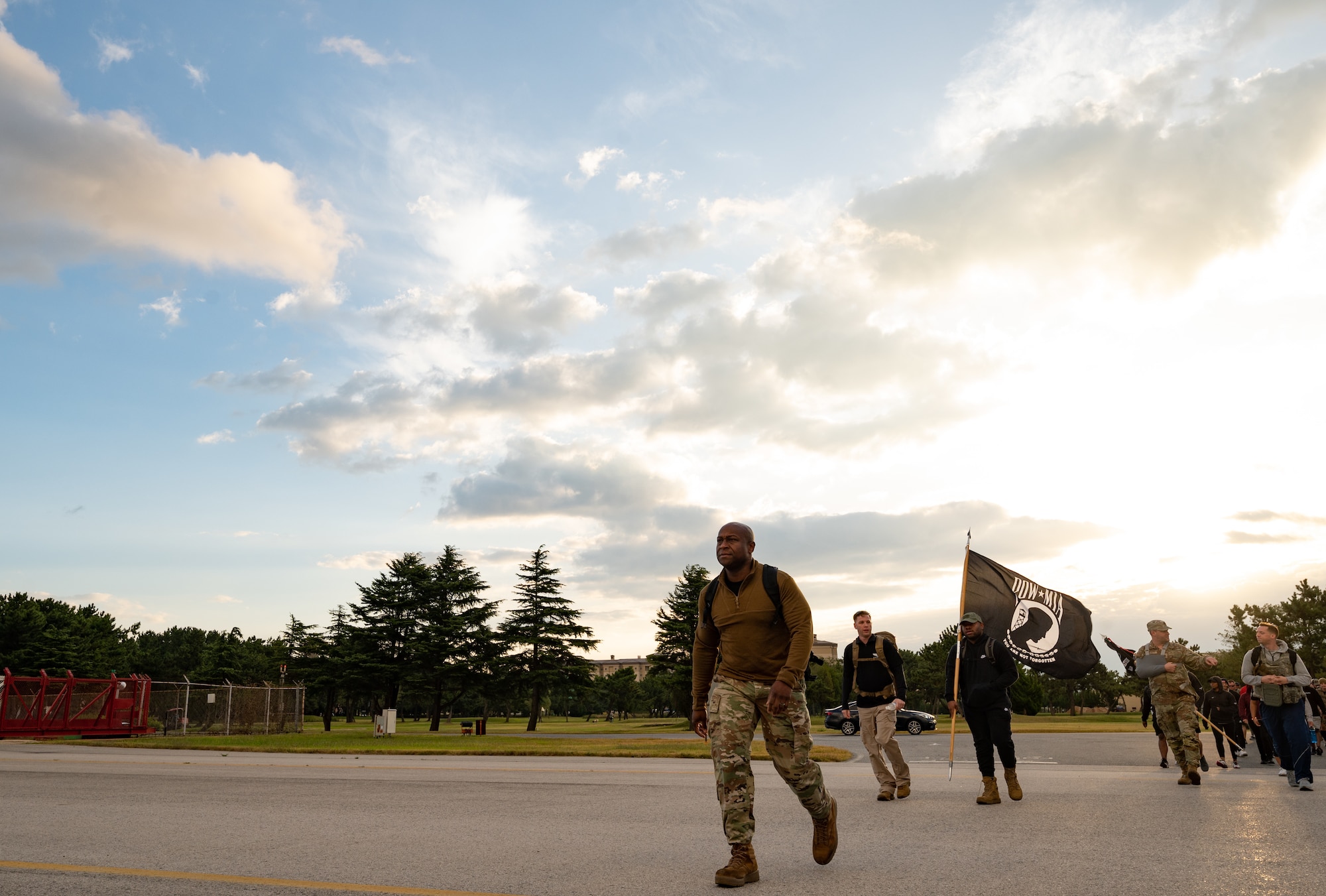 Col. Henry R. Jeffress, 8th Fighter Wing commander, leads the pack during a Prisoner of War and Missing In Action ruck event at Kunsan Air Base, Republic of Korea, Oct. 7, 2022. Several 8th Fighter Wing leaders participated in the ruck, honoring prisoners of war and the more than 81,000 U.S. service members who went missing during past conflicts. (U.S. Air Force photo by Staff Sgt. Sadie Colbert)