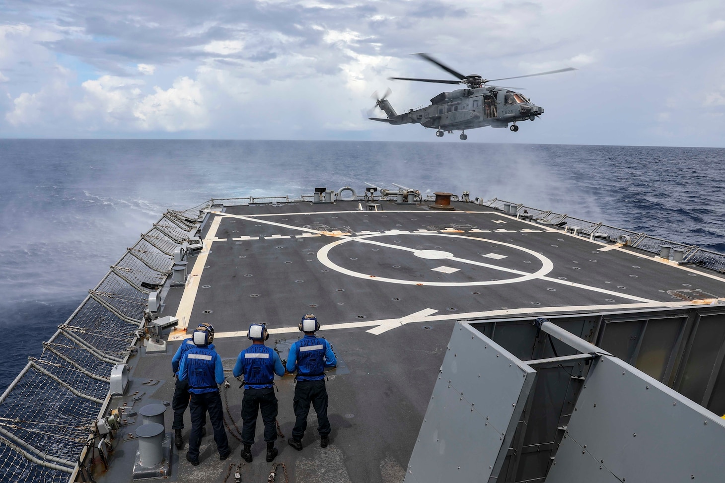 SOUTH CHINA SEA (Oct. 5, 2022) A Canadian Sikorsky CH-148 Cyclone helicopter attached to the Royal Canadian Navy Halifax-class frigate HMCS Winnipeg (FFH 338) approaches the flight deck aboard Arleigh Burke-class guided-missile destroyer USS Higgins (DDG 76) while conducting multi-lateral operations in the South China Sea, Oct. 5. The United States, with Japan Maritime Self Defense Force and Royal Canadian Navy are participating in multi-lateral exercises in the South China Sea in support of the Royal Australian Navy’s regional presence deployment. Exercises like this reassure our allies and partners of our combined commitment to maintaining a free and open Indo-Pacific. (U.S. Navy photo by Mass Communication Specialist 1st Class Donavan K. Patubo)