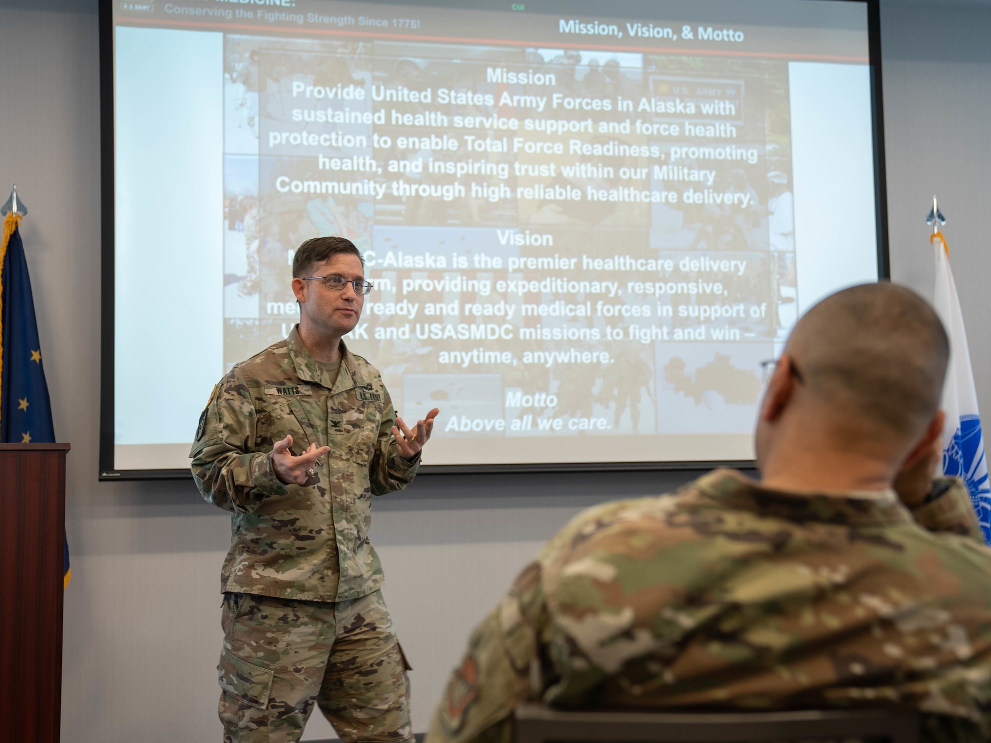 Col. James Watts briefs people.