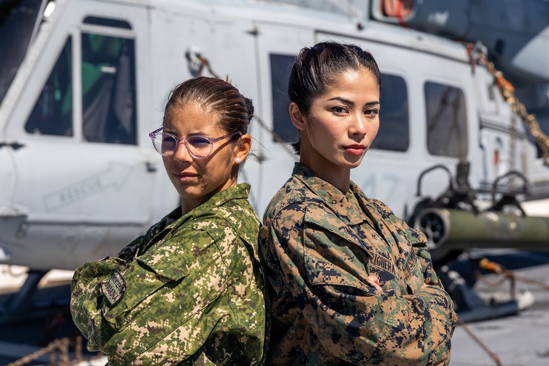 U.S. Marine Corps Lance Cpl. Charisse Briguera, right, a rifle Marine with Delta Company, 4th Light Armored Reconnaissance Battalion, 4th Marine Division, in support of Special Purpose Marine Air-Ground Task Force UNITAS LXIII poses for a photo with Marina Milagros Correa (Private Uruguayan Marine Corps) during exercise UNITAS LXIII aboard the USS Mesa Verde (LPD 19), Sept. 10, 2022. UNITAS is the world’s longest-running annual multinational maritime exercise that focuses on enhancing interoperability among multiple nations and joint forces during littoral and amphibious operations in order to build on existing regional partnerships and create new enduring relationships that promote peace, stability, and prosperity in the U.S. Southern Command’s area of responsibility. (U.S. Marine Corps photo by Lance Cpl. David Intriago)