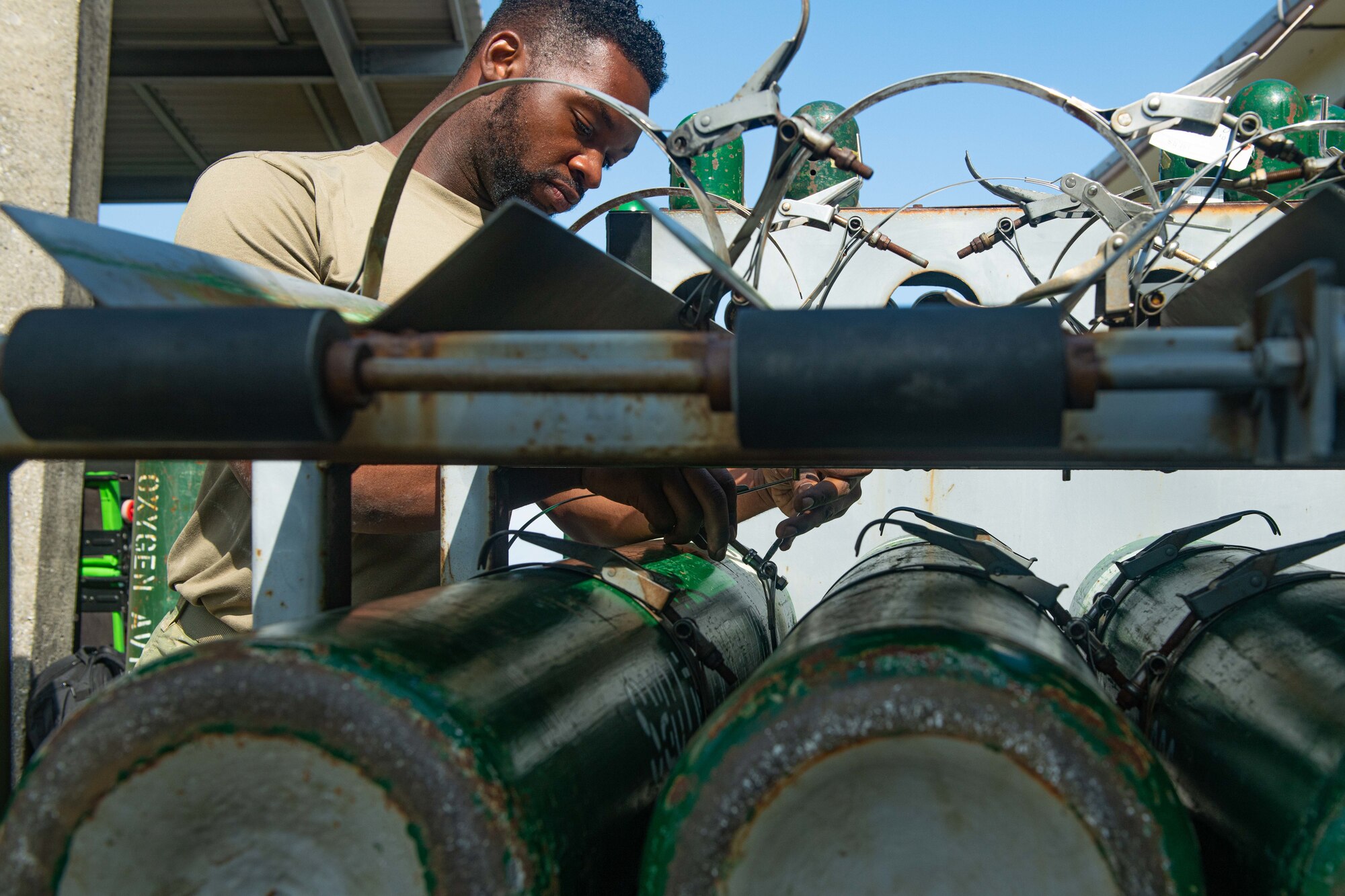 An Airman repairs a clamp.