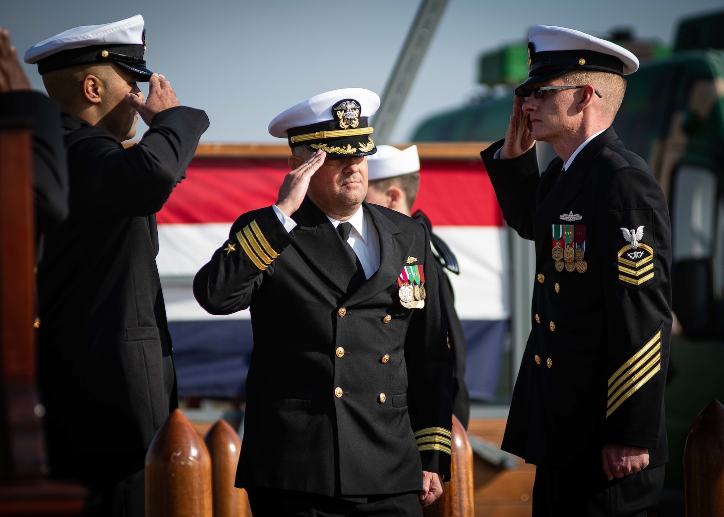 Cmdr. Jonathan P. Schermerhorn, Commander, U.S. Aegis Ashore Missile Defense System Romania (USAAMDSRO), renders a hand salute to sideboys following a change of command ceremony on Naval Support Facility (NSF) Deveselu, Romania, Oct. 14, 2022.