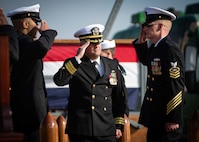 Cmdr. Jonathan P. Schermerhorn, Commander, U.S. Aegis Ashore Missile Defense System Romania (USAAMDSRO), renders a hand salute to sideboys following a change of command ceremony on Naval Support Facility (NSF) Deveselu, Romania, Oct. 14, 2022.