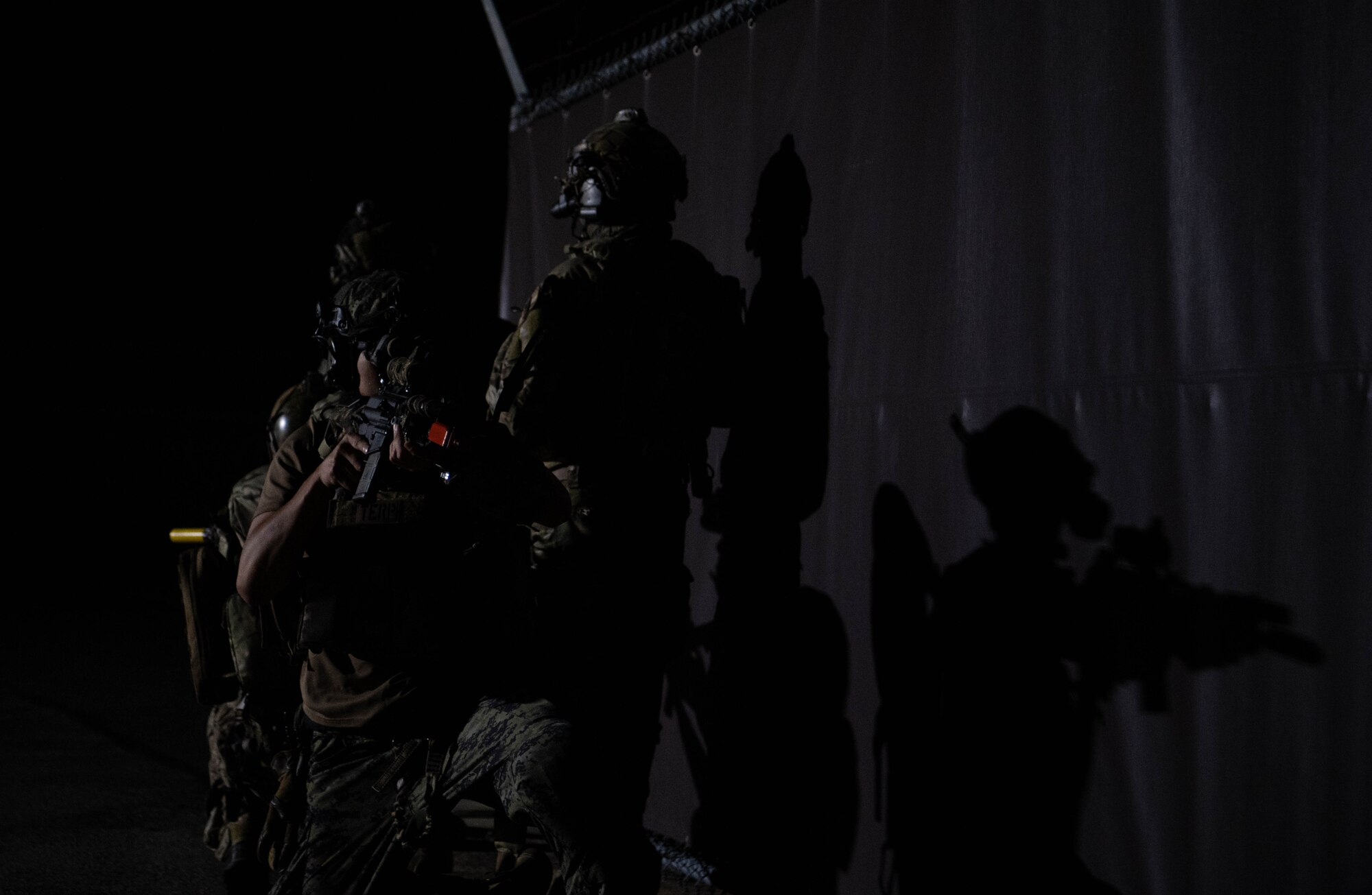 Operators participating in joint training between U.S. and Republic of Korea (ROK) special operations forces, watch their sectors of fire