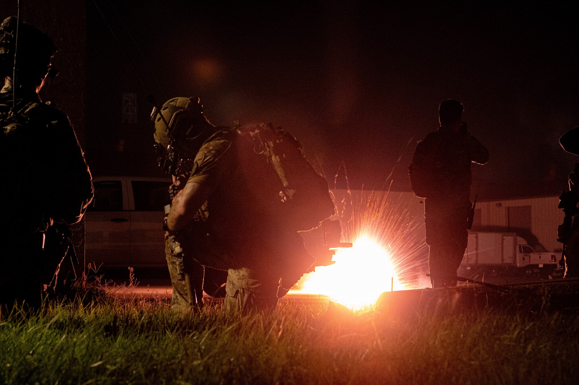 Operators participating in joint training between U.S. and Republic of Korea (ROK) special operations forces, take cover as mock explosives detonate