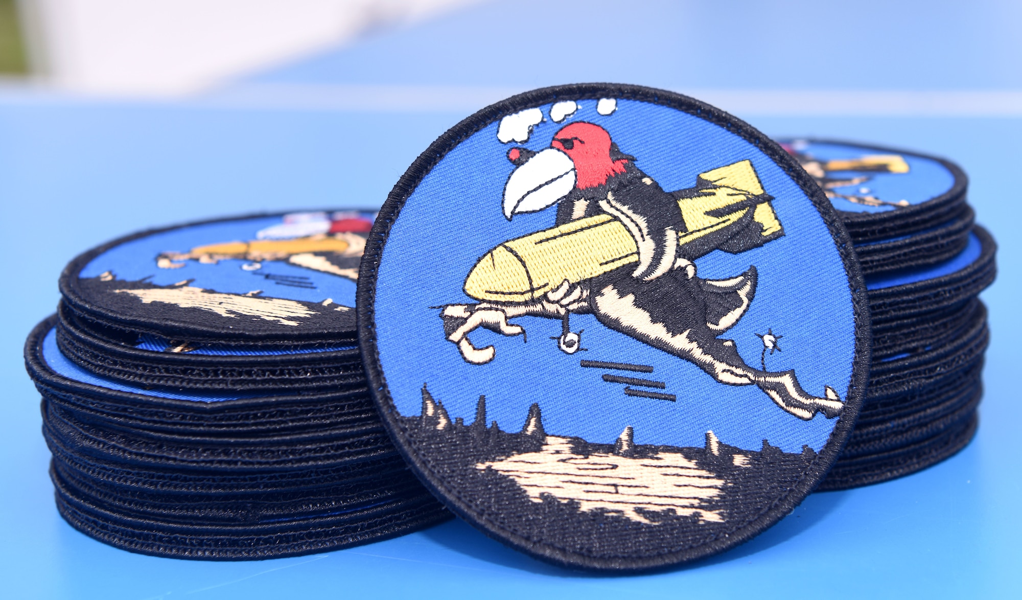 Heritage patches, known as the Buzzard patch, are ready to be presented to pilots and boom operators who have completed mission certification training at the 100th Bomb Group Memorial Museum, Thorpe Abbotts, England, Oct. 14, 2022. Thorpe Abbotts was home to the original 351st Bomb Squadron and 100th Bomb Group during World War II. Only those who have completed MCT can wear the patch on Fridays. (U.S. Air Force photo by Karen Abeyasekere)
