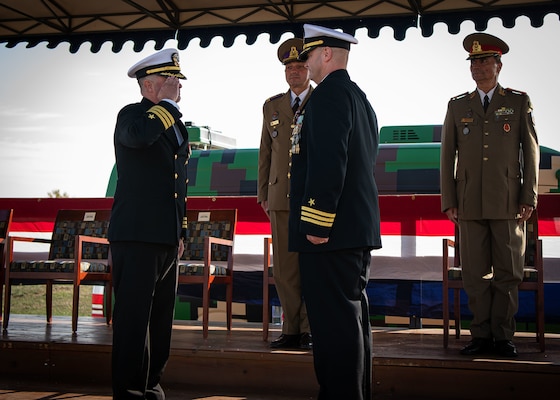 Cmdr. Jonathan P. Schermerhorn receives command of U.S. Aegis Ashore Missile Defense System Romania (USAAMDSRO) from Cmdr. Frederick G. Hettling during a change of command ceremony on Naval Support Facility (NSF) Deveselu, Romania, Oct. 14, 2022.
