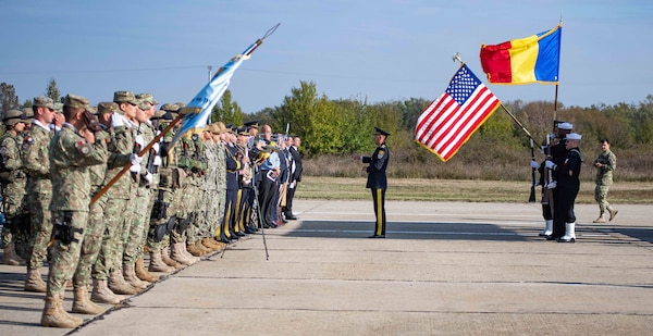 The honor guard posts the colors during a U.S. Aegis Ashore Missile Defense System Romania (USAAMDSRO) change of command ceremony on Naval Support Facility (NSF) Deveselu, Romania, Oct. 14, 2022.