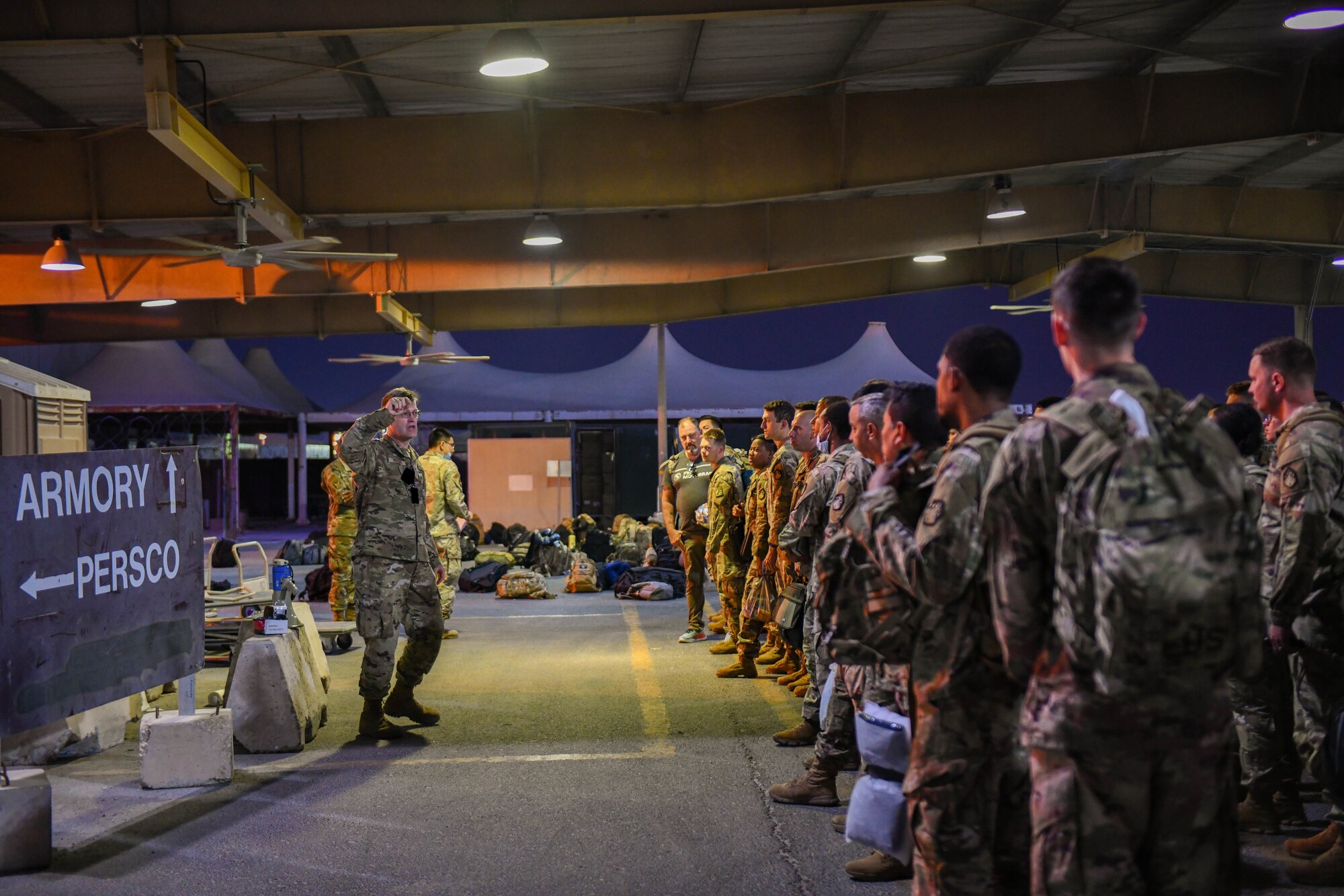 Members of the 379th Expeditionary Force Support Squadron Personnel Support for Contingency Operations team in-process incoming personnel on Al Udeid Air Base, Qatar, Oct. 14, 2022. The Reception Control Center ensures records are properly maintained for inbound personnel. (U.S. Air National Guard photo by Airman 1st Class Constantine Bambakidis) (Photo was modified for security purposes)