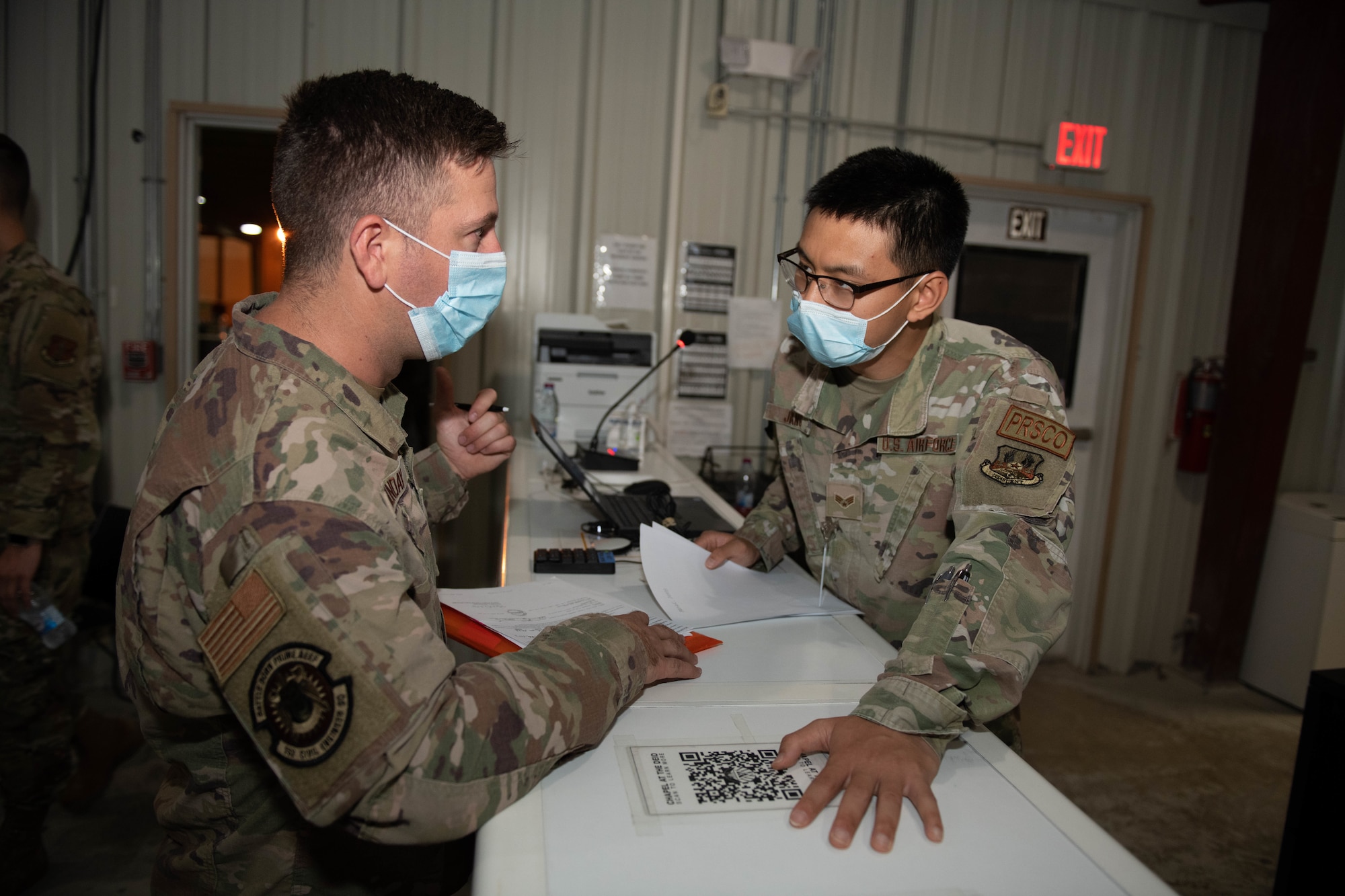 Members of the 379th Expeditionary Force Support Squadron Personnel Support for Contingency Operations team in-process incoming personnel on Al Udeid Air Base, Qatar, Oct. 14, 2022. The Reception Control Center ensures records are properly maintained for inbound personnel. (U.S. Air National Guard photo by Airman 1st Class Constantine Bambakidis) (Photo was modified for security purposes)