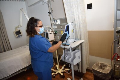 Michelle Glodzik housekeeper, Womack Army Medical Center sanitizes patient room at WAMC on August 19, 2022