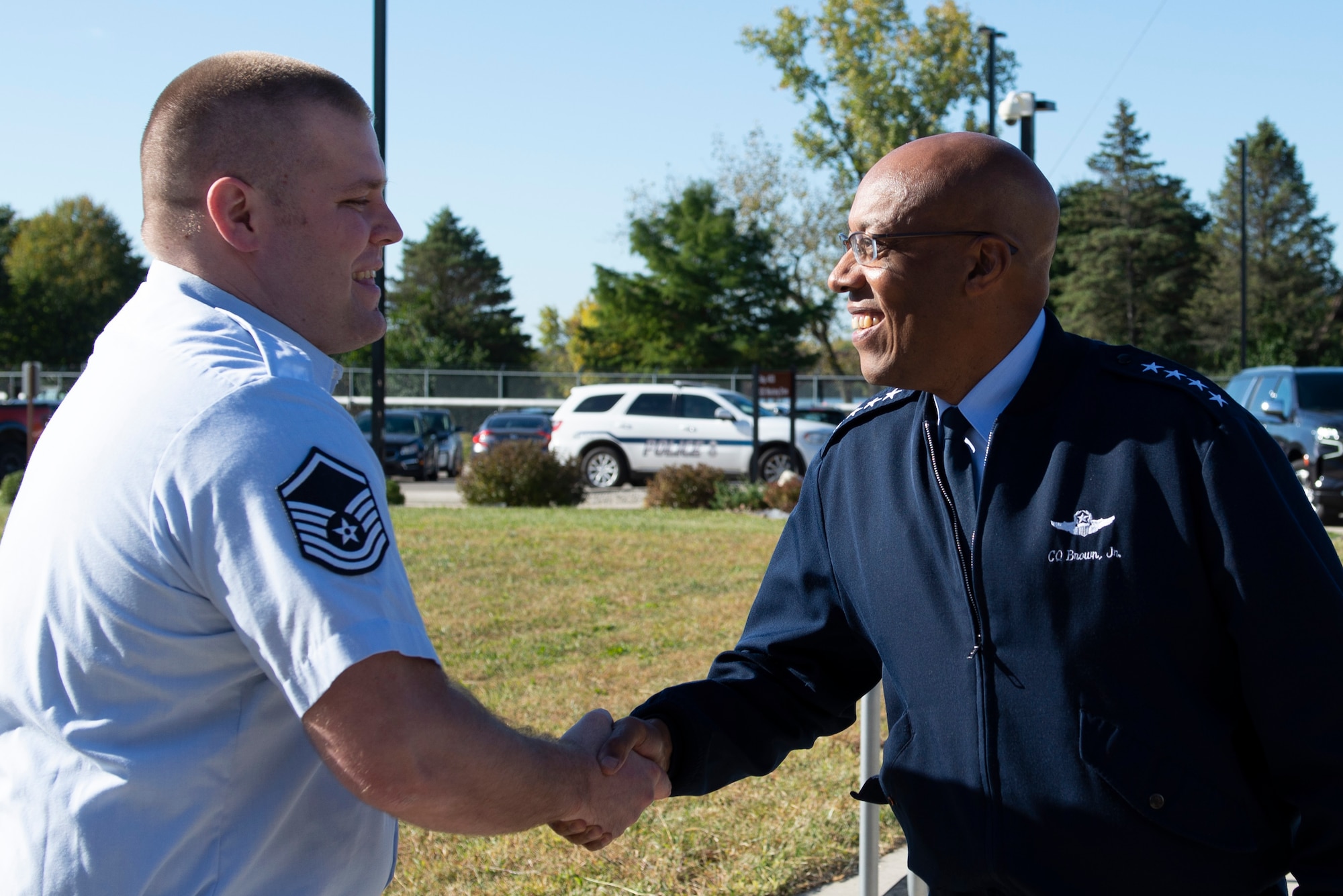 Master Sgt. Aaron Clark, National Air and Space Intelligence Center vulnerability analysis manager, receives a coin from Air Force Chief of Staff Gen. CQ Brown, Jr., Wright-Patterson Air Force Base, Ohio, Oct. 10, 2022. During Brown’s trip to Wright-Patterson, he visited NASIC for a capabilities tour and a series of intelligence briefings. (U.S. Air Force photo by Staff Sgt. Samuel Earick)