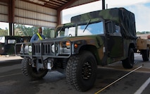 Air Force personal inspects a Humvee