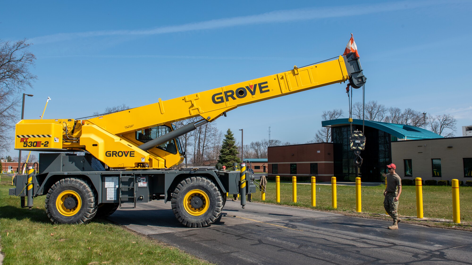 Airmen, assigned to the Ohio Air National Guard’s 200th RED HORSE, move a crane into position during Crash Damaged/Disabled Aircraft Recovery training April 23, 2022 at the 180th Fighter Wing in Swanton, Ohio.