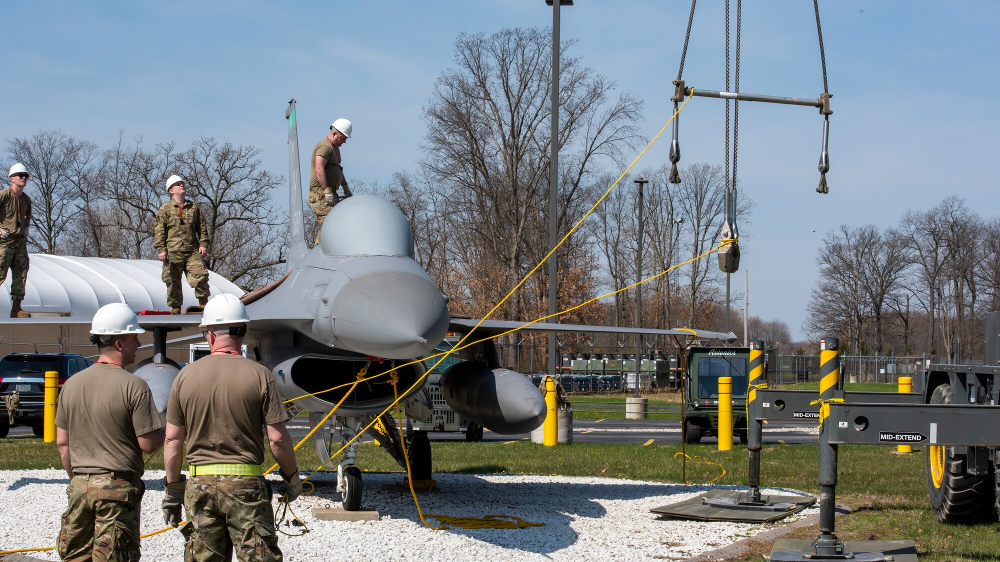 Airmen, assigned to the Ohio Air National Guard’s 180th Fighter Wing, prepare equipment to lift an F-16 Fighting Falcon during Crash Damaged/Disabled Aircraft Recovery training April 23, 2022 in Swanton, Ohio.