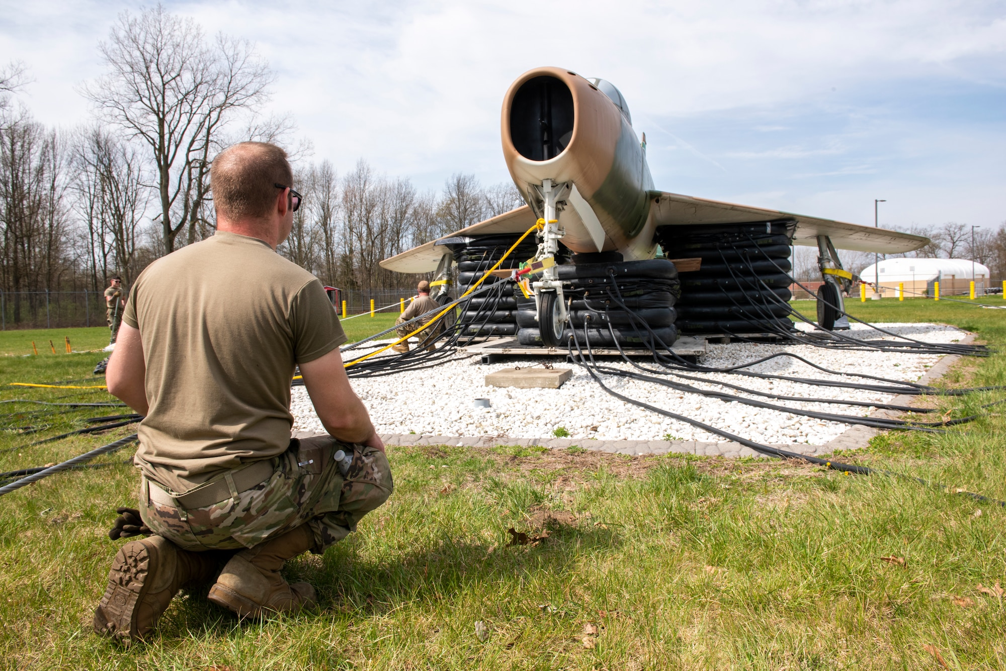 Airmen, assigned to the Ohio Air National Guard’s 180th Fighter Wing, move an aircraft during Crash Damaged/Disabled Aircraft Recovery training April 24, 2022 in Swanton, Ohio.