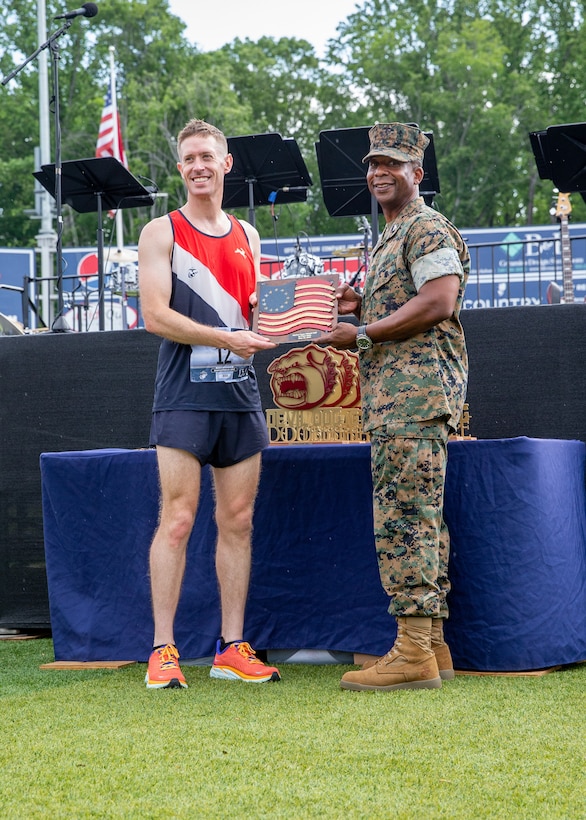 Kyle King, a native of Alexandria, Virginia, wins Marine Corps Marathon Historic Half with a time of one hour, 13 minutes and 24 seconds at the Fredericksburg Expo and Conference Center, Fredericksburg, Virginia, May 22, 2022. The Historic Half is a 13.1 mile race drew roughly 4,000 participants to promote physical fitness, generate goodwill in the community, and showcase the organizational skills of the Marine Corps. The event also included the Semper Five, 5 miles, and the Devil Dog Double, 18.1 miles. (US Marine Corps photo by Lance Cpl. Kayla LaMar)