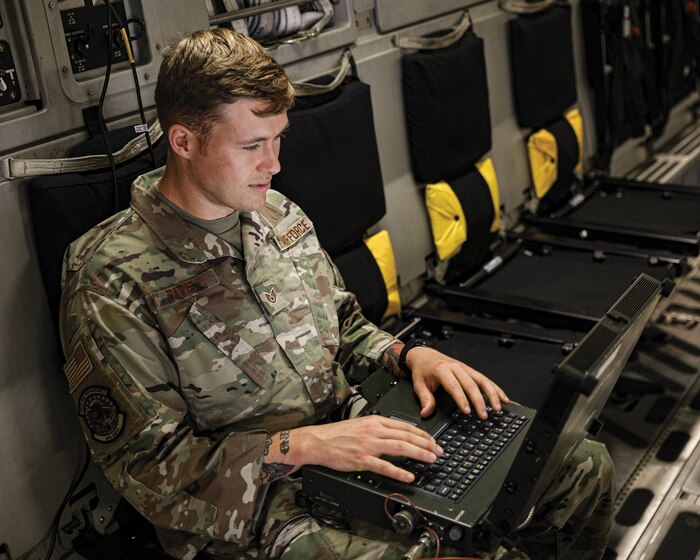 Staff Sgt. Ryan Davis, 445th Aircraft Maintenance Squadron avionics specialist, troubleshoots communication systems aboard a C-17 Globemaster III at Wright-Patterson Air Force Base, Ohio.