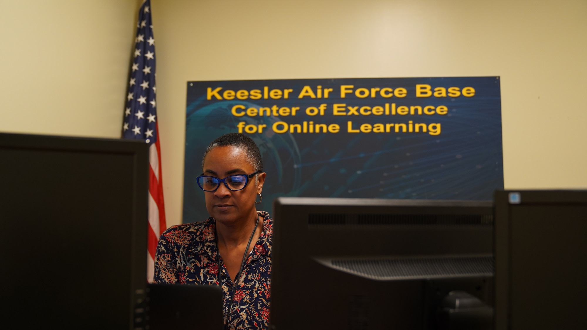 Anita Thomas, 81st Training Support Squadron online courses instructor, simulates teaching in the broadcast room in Allee Hall at Keesler Air Force Base, Mississippi, Oct. 11, 2022. This room is used by instructors to facilitate learning sessions for the 81 TRSS online curriculum, including the Online Faculty Development Course.