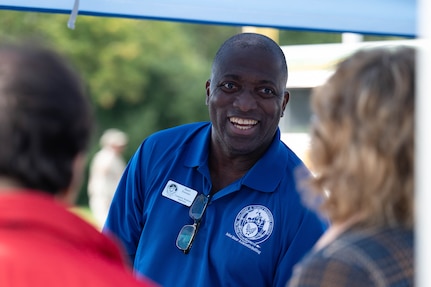 Basil Forrest, Military and Readiness Center Community Readiness Supervisor, speaks with attendees about services available through the M&FRC at the Sentinels Celebration, Joint Base Anacostia-Bolling, Washington, D.C., Oct. 12, 2022. The Sentinels Celebration hosted a variety of booths from units on JBAB and mission partners across the National Capital Region. (U.S. Air Force photo by Kristen Wong)