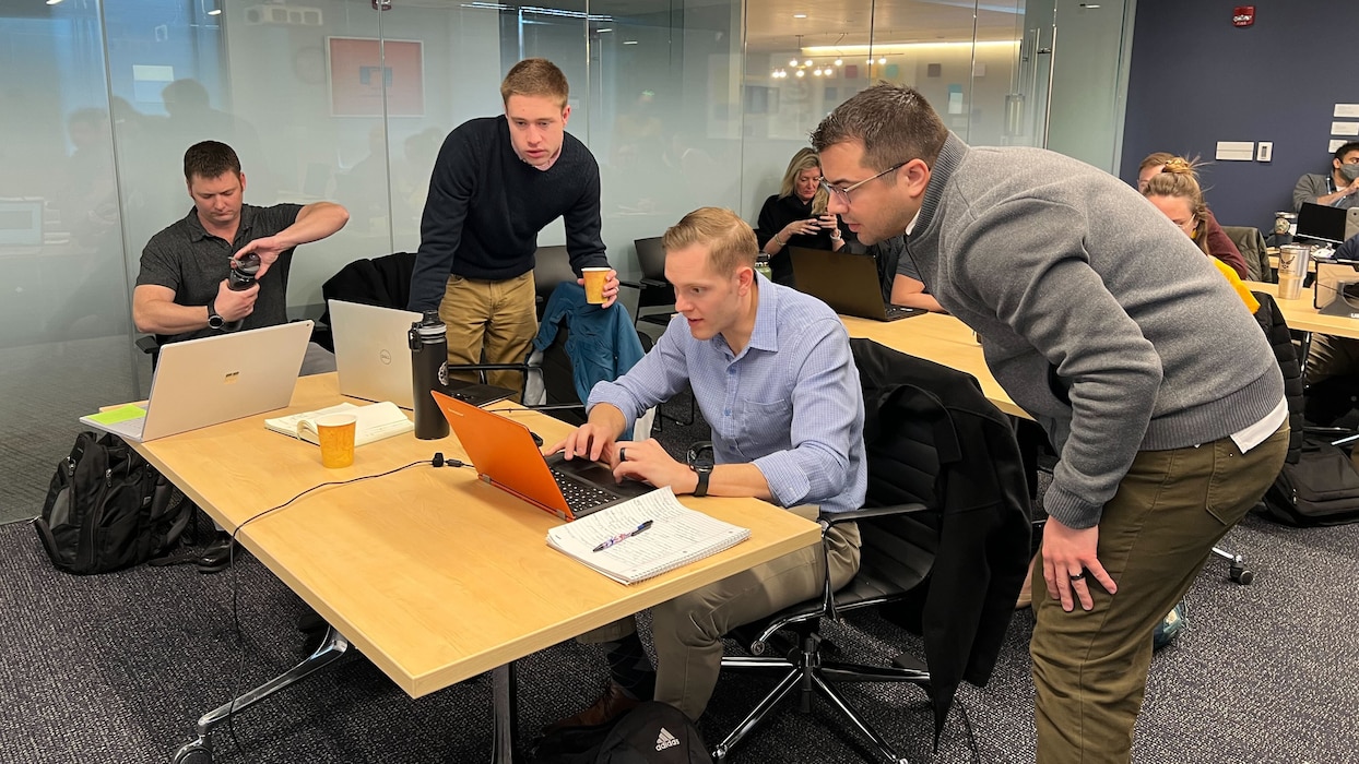 Students collaborate during the Department of the Air Force-Massachusetts Institute of Technology Artificial Intelligence Accelerator’s Autonomous Cognitive Assistance, or CogWorks, course at MIT’s open learning space in Cambridge, Mass, March 28. The course taught participants how to develop algorithms to create AI capabilities. (U.S. Air Force photo by Capt. Vicente Pamparo)