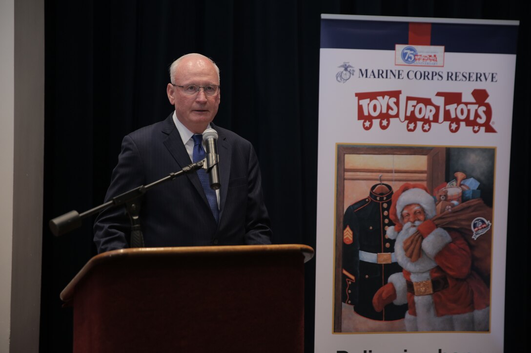 James Laster, Chief Executive Officer of Toys for Tots, addresses Marines and members of the Toys for Tots program during a celebration of the program’s 75th anniversary at Marine Barracks Washington in Washington, D.C., June 3, 2022. Toys for Tots aims to provide happiness and hope to disadvantaged children through the gift of a new toy during the Christmas holiday season. The toys, books, and other gifts collected and distributed by Reserve Marines and the Toys for Tots Foundation offers these children recognition and a positive memory that can last a lifetime. (U.S. Marine Corps photo by Lance Cpl. Briana Vera/Released)