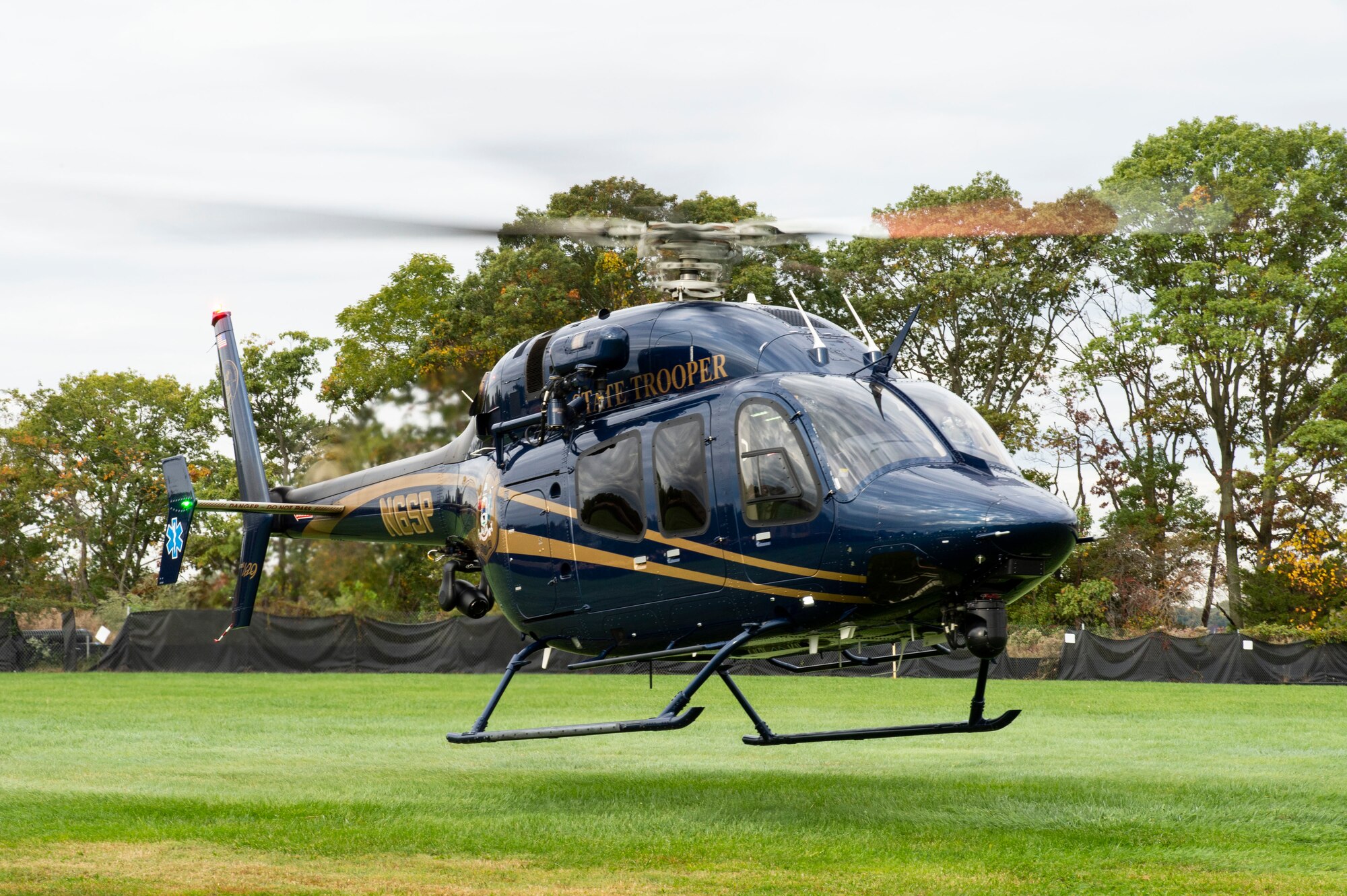 A Delaware State Police helicopter takes off with a simulated active shooter victim enroute to a local hospital during an active shooter exercise held at Dover Air Force Base, Delaware, Oct. 14, 2022. The simulated gunshot victim was transported by helicopter to Kent General Hospital located in Dover, Delaware. Teachers and volunteers acted as hostages and casualties for the exercise held at the Maj. George S. Welch Elementary and Dover Air Base Middle Schools. (U.S. Air Force photo by Roland Balik)