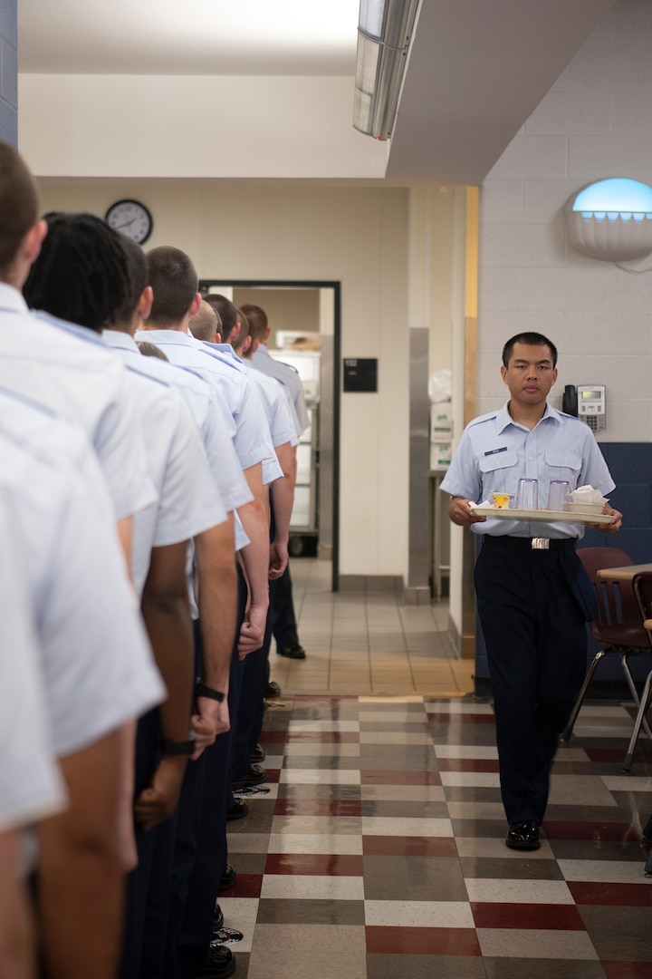U.S. Air Force basic trainees from the 331st Training Squadron, Flight 677, for a line waiting for permission to enter the food serving line to eat lunch during basic military training Sept. 20, 2022, at Joint Base San Antonio-Lackland, Texas.