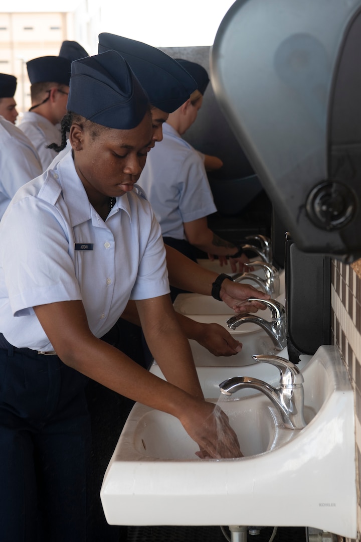 Flights must wash their hands every time they enter any dining facility prior to meals.