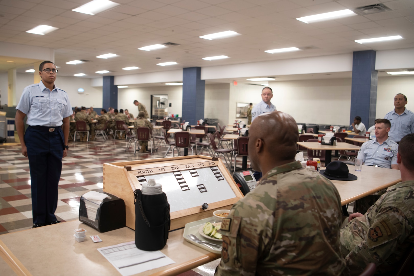 Flights must request permission from the "Snake Pit" so there is control of how many flights enter and exit the dining facility ensuring the area does not become overwhelmed with too many people at one time.