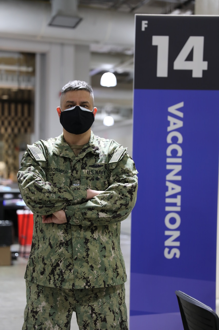 U.S. Navy Capt. John R. Desormier, a Navy Emergency Preparedness Officer (NEPLO) assigned to FEMA Region 1, provides Defense Support for Civil Authorities at the Hynes Convention Center COVID-19 Community Vaccine Center, Boston, Mass., April 21, 2021. U.S. service members from across the country are deployed in support of the Department of Defense federal vaccine response operations. U.S. Northern Command, through U.S. Army North,  remains committed to providing continued, flexible DoD support to the Federal Emergency Management Agency as part of the whole-of-government response to COVID-19. (U.S. Army photo by Capt. Jennifer Pendleton / 14th Public Affairs Detachment)