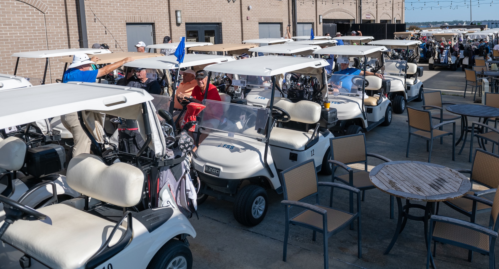 Golfers wait in the carts during the Bay Breeze Golf Course reopening ceremony at the Bay Breeze Event Center on Keesler Air Force Base, Mississippi, Oct. 14, 2022. The Ribbon Cutting Ceremony was followed by a four player scramble, prizes for teams, food and drinks. (U.S. Air Force Photo by Andre' Askew)