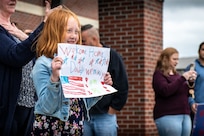 family members prepare to greet returning Airmen