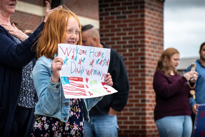 family members prepare to greet returning Airmen