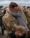 An Airman hugs his child