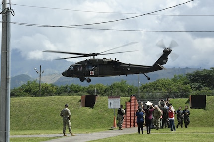 U.S. Army soldiers simulate a medical evacuation during an exercise following the Medical Effects of Ionizing Radiation course at Soto Cano Air Base, Honduras on 14 Oct 2022.